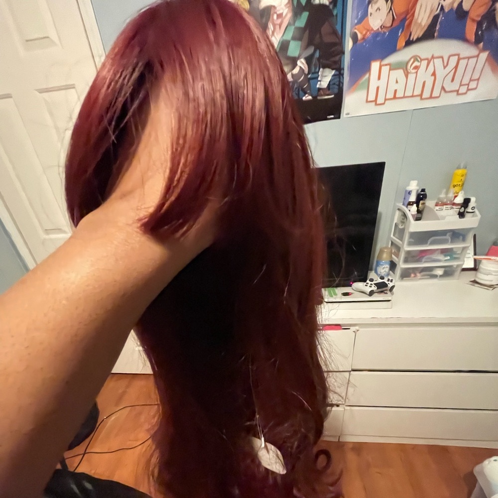 A dark red wig. long and comes with bangs. come with wig cap/pair of lashes